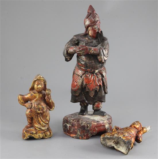 A Chinese polychrome lacquered wood figure of a temple guardian, 18th / 19th century, 16.5cm (3)